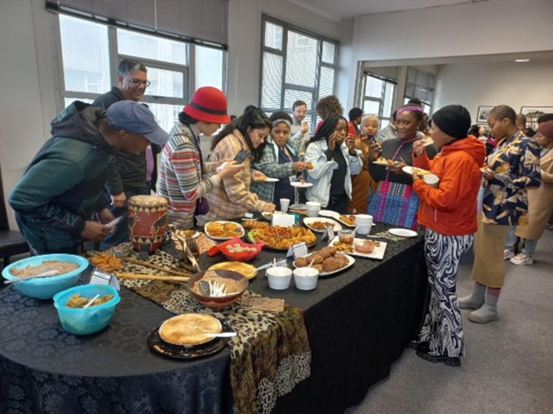 Staff and students waiting to try out some traditional African snacks