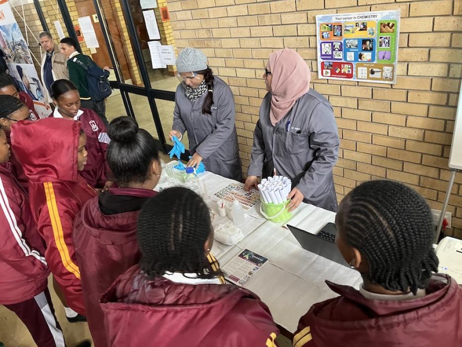 Two scientists showing learners some fun chemistry experiments