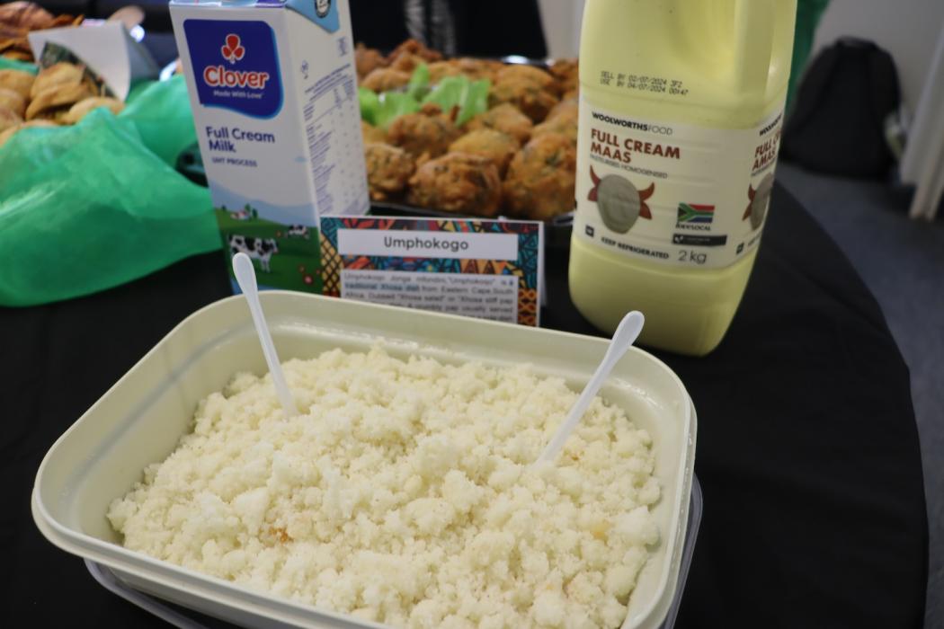 A starch meal that looks like pap with full cream milk and full cream maas on the table