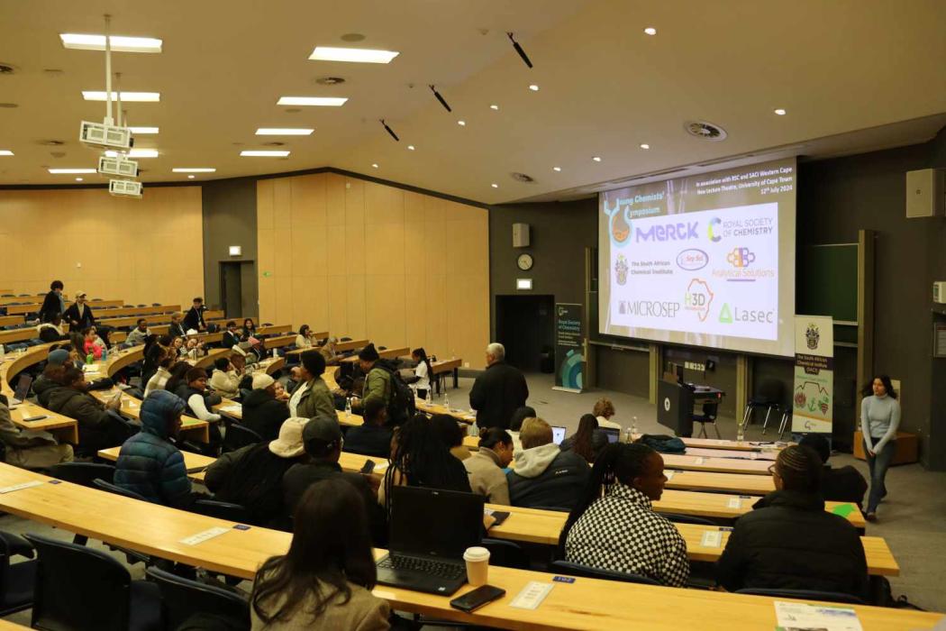 Attendees entering the lecture venue and eagerly waiting for the programme to start.
