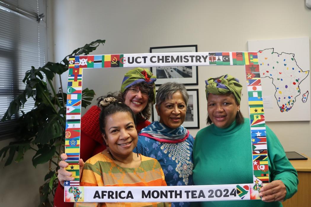 People posing with UCT Chemistry Africa Month Tea 2024 Banner