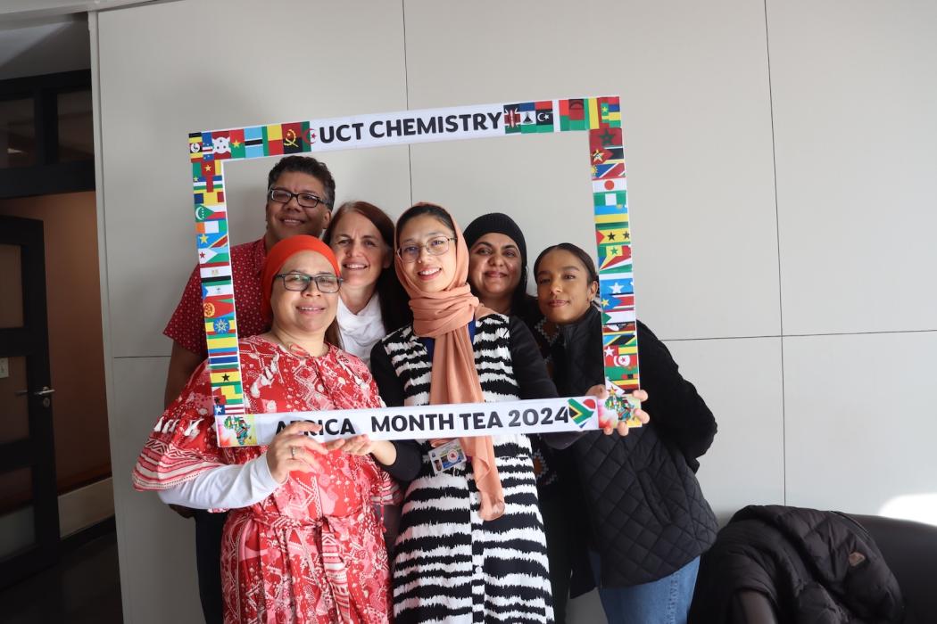 People posing with UCT Chemistry Africa Month Tea 2024 Banner