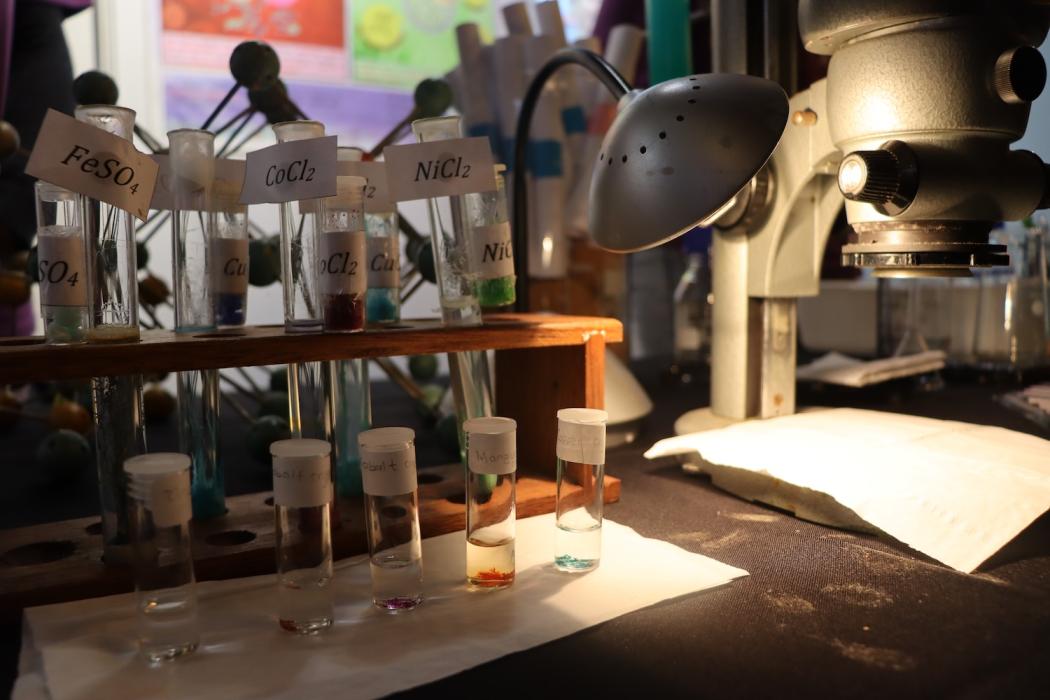 Crystal garden and microscope on the chemistry exhibition table