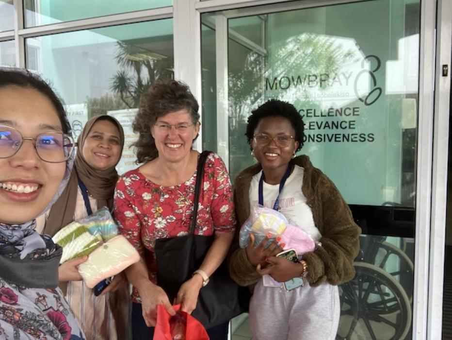 A group of women from the chemistry department standing outside the mowbray maternity clinic