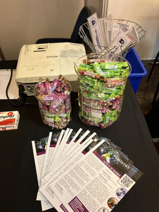 Sweets and pamphlets on the chemistry exhibition table