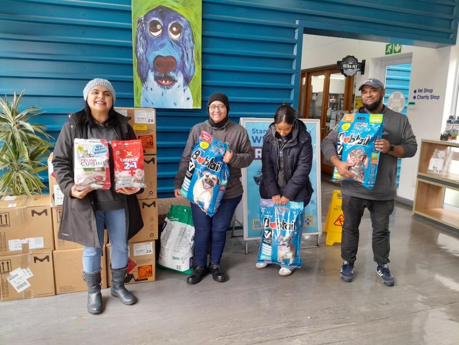 UCT chemistry team holding items they delivered