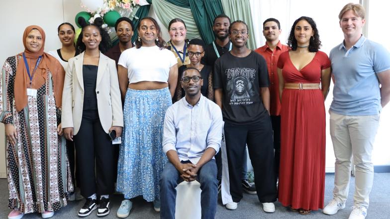 University students posing for a group photo with course convenor