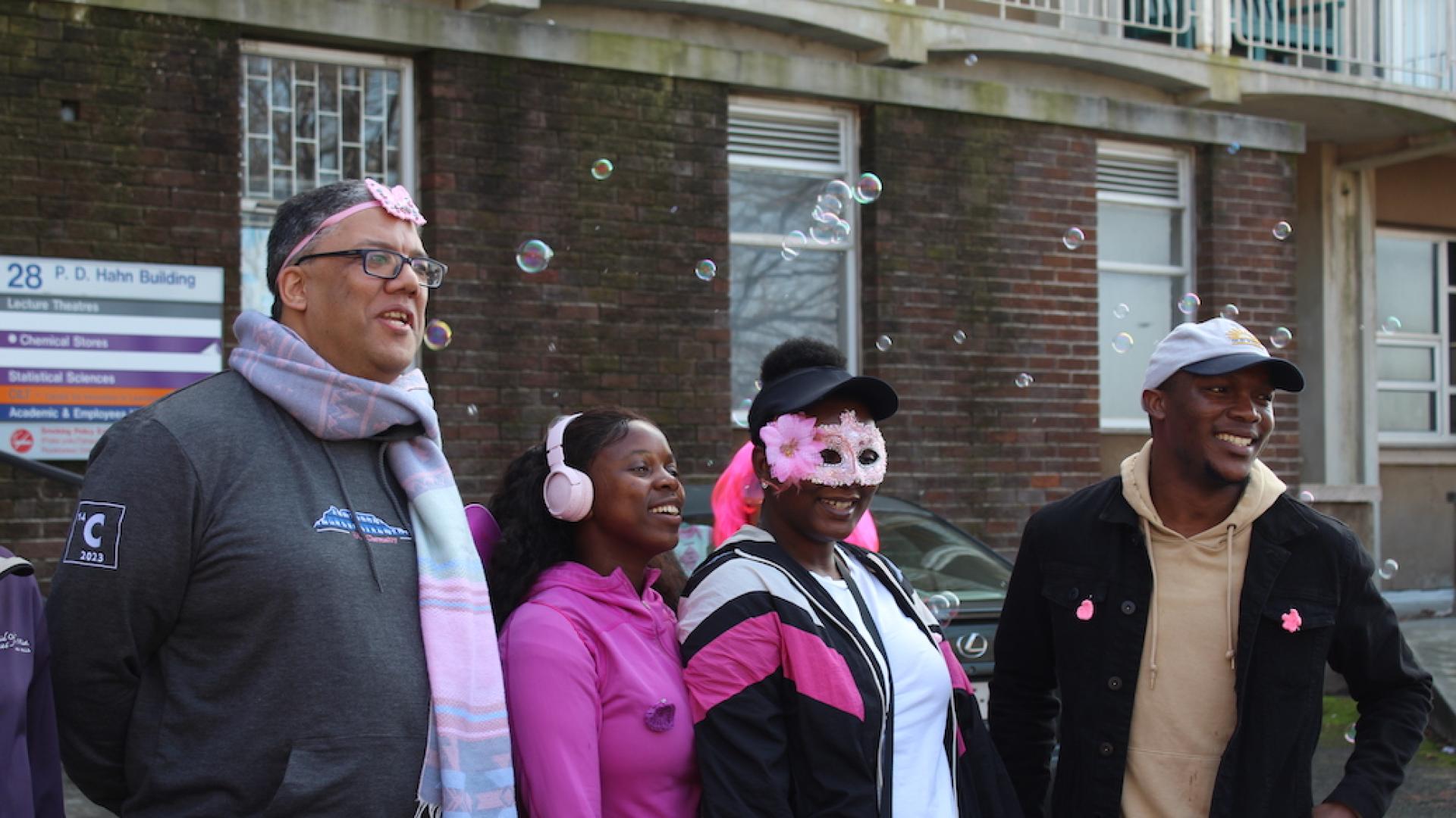 Participants within the Dept of Chemistry all dressed up in their finest pink accessories and eagerly awaiting the start of the walk outside PD Hahn Building.