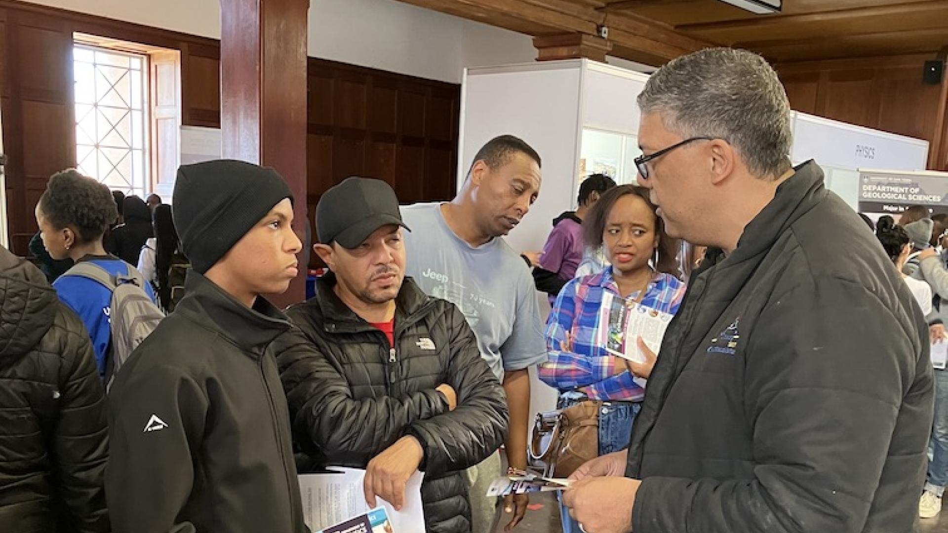 Dr Oliver advising a learner and parent on opportunities available with a BSc. Chemistry Major
