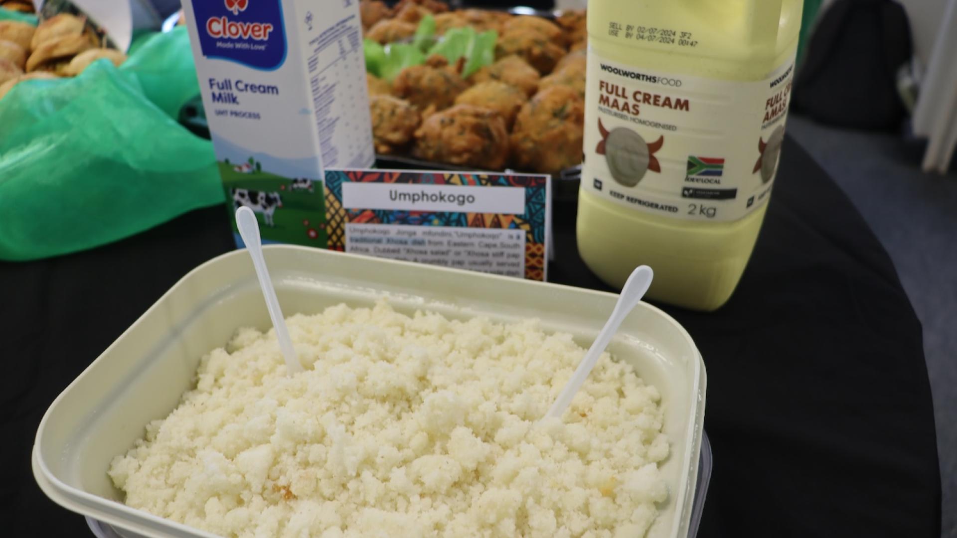 A starch meal that looks like pap with full cream milk and full cream maas on the table