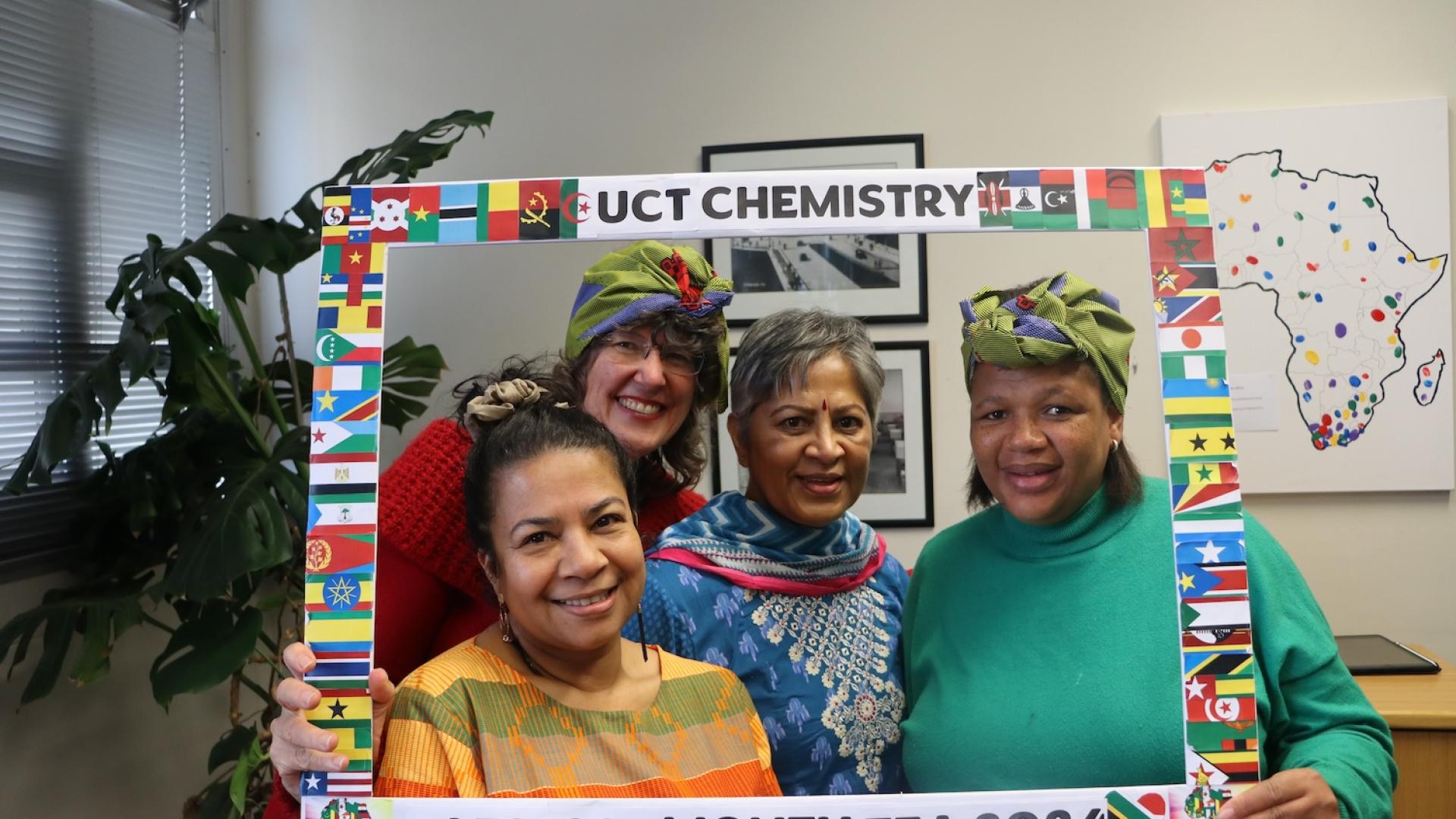 People posing with UCT Chemistry Africa Month Tea 2024 Banner