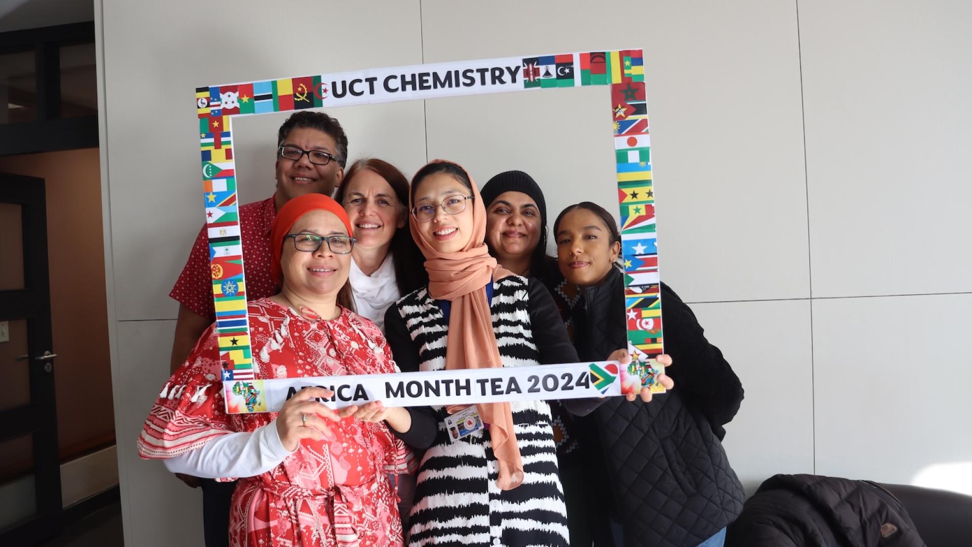 People posing with UCT Chemistry Africa Month Tea 2024 Banner