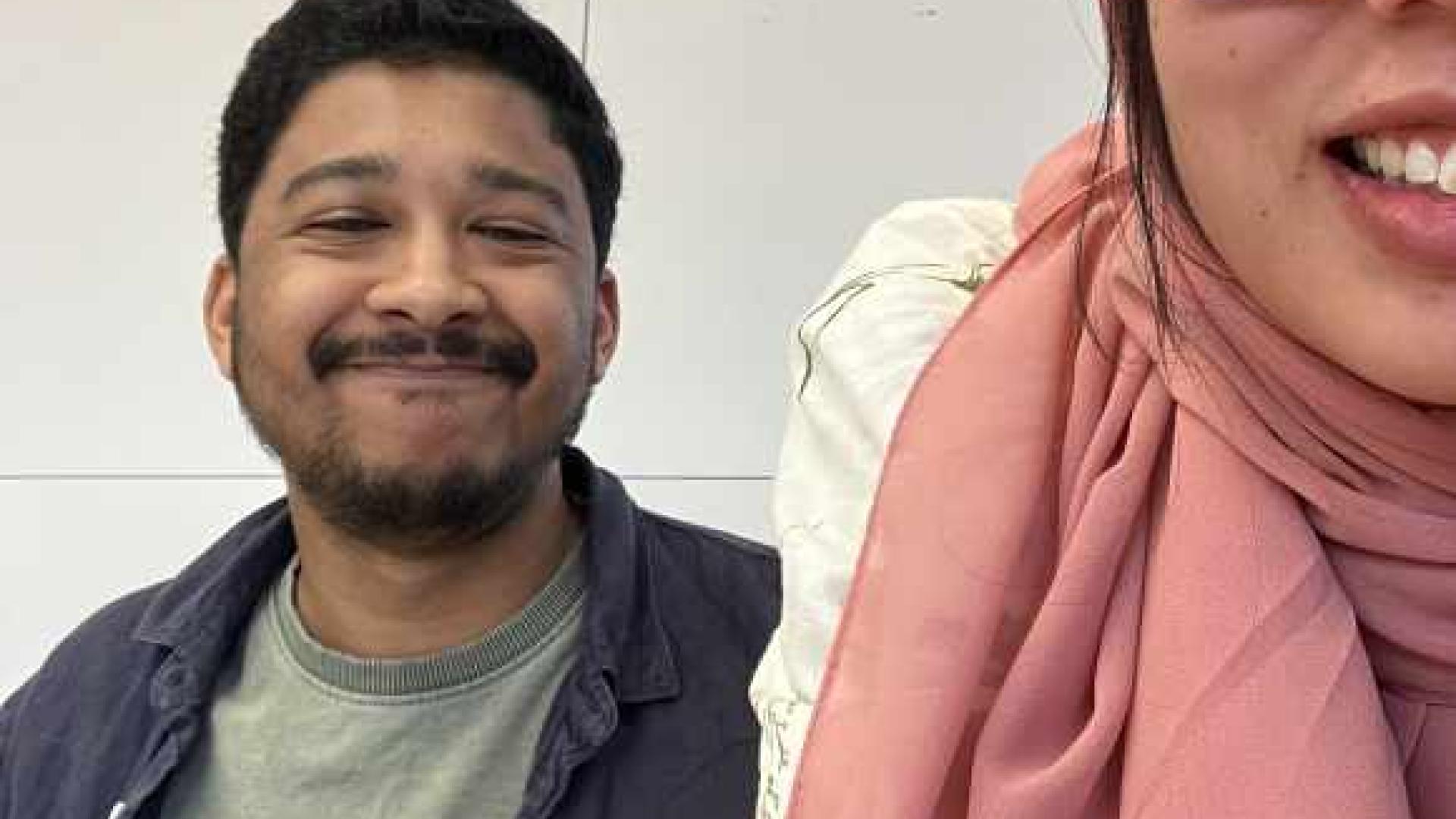 Two people smiling.