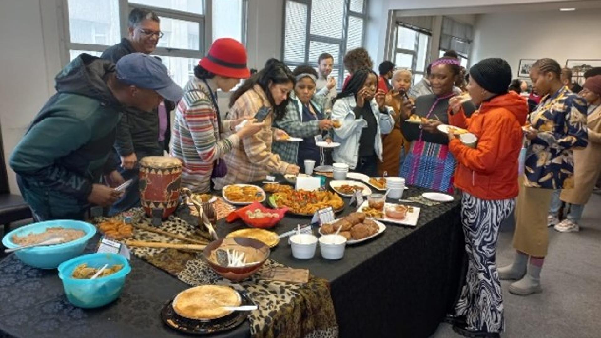 Staff and students waiting to try out some traditional African snacks