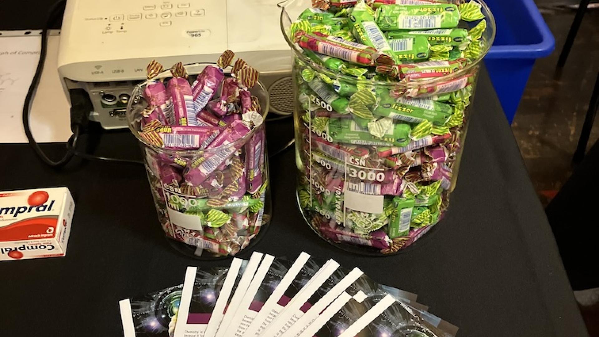 Sweets and pamphlets on the chemistry exhibition table