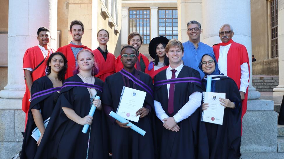 Group of graduants with their supervisions on steps at UCT