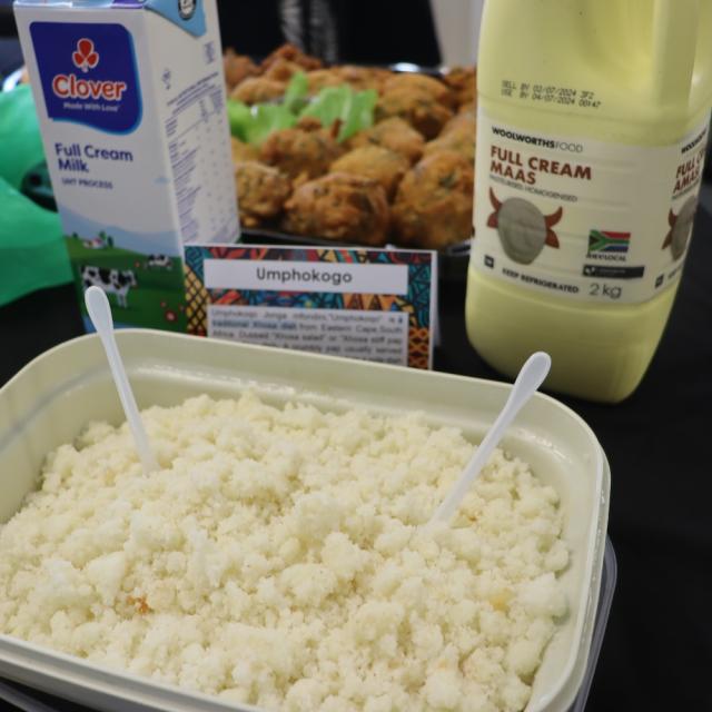 A starch meal that looks like pap with full cream milk and full cream maas on the table