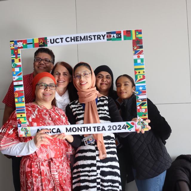 People posing with UCT Chemistry Africa Month Tea 2024 Banner