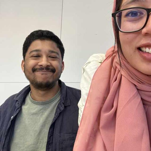 Two people smiling.