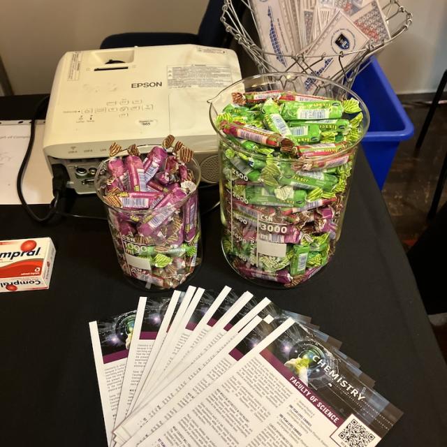 Sweets and pamphlets on the chemistry exhibition table