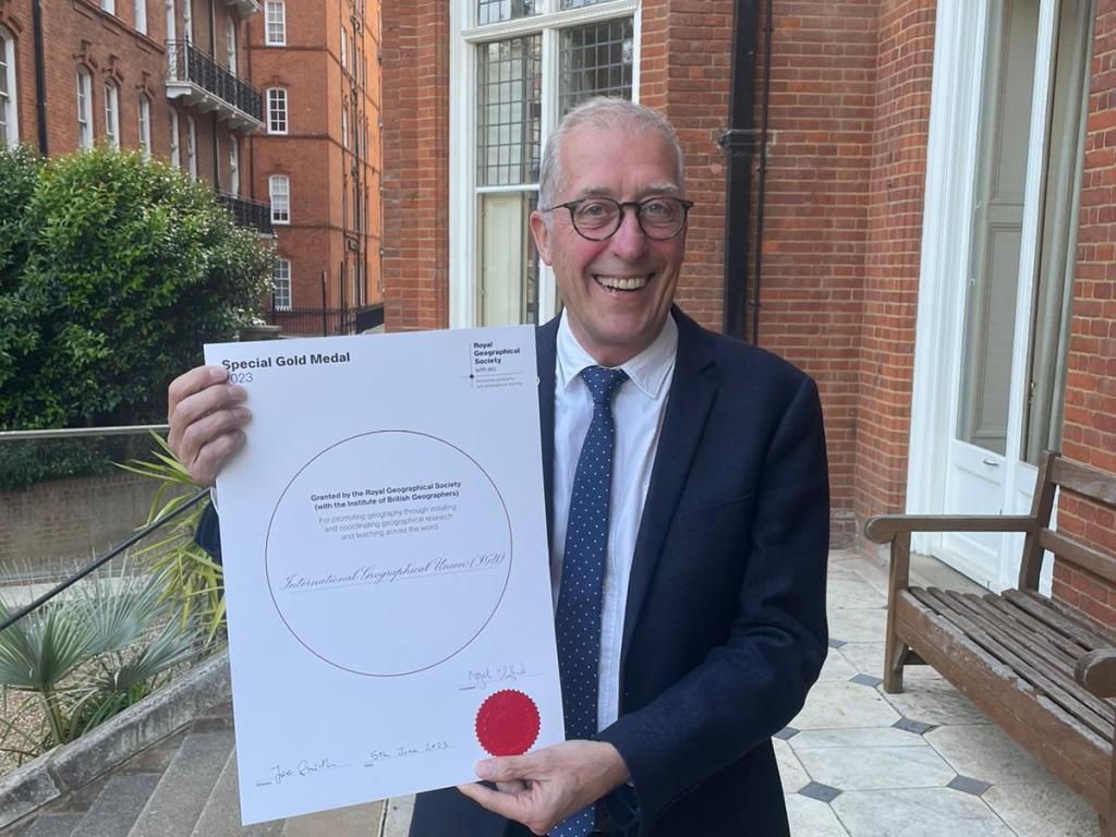 Michael Meadows with award certificate