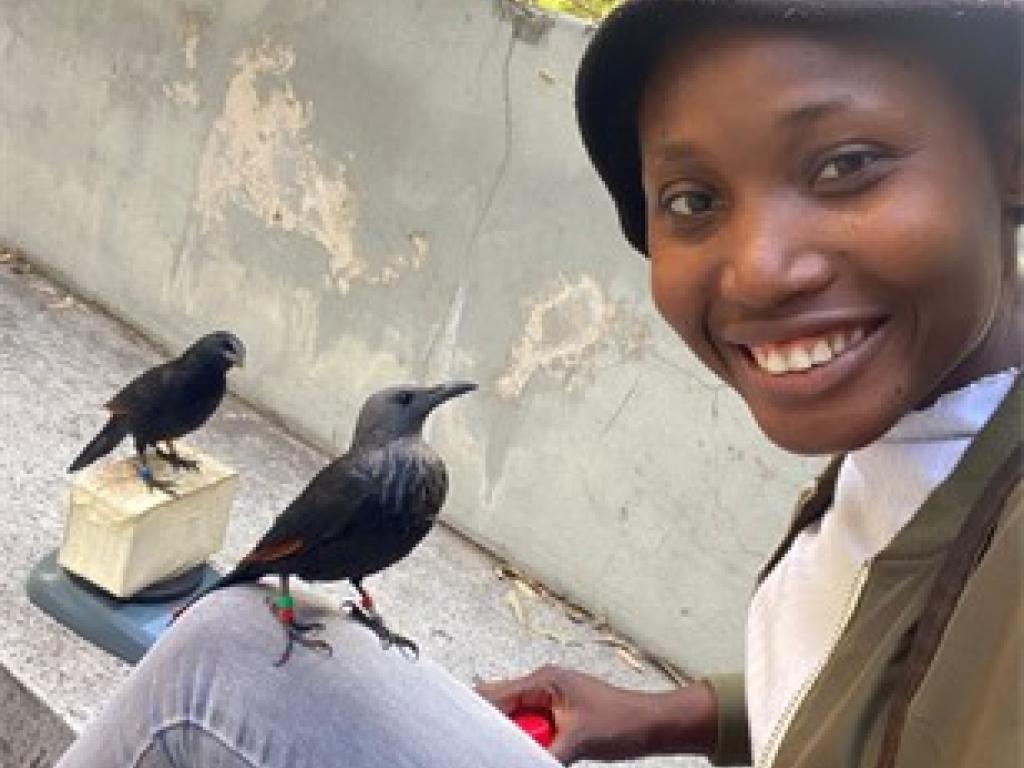 student with red-winged starling