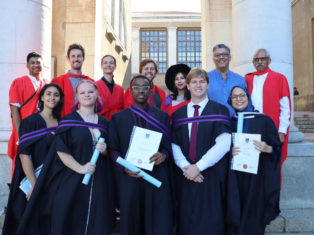Group of graduants with their supervisions on steps at UCT