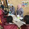 Two scientists showing learners some fun chemistry experiments